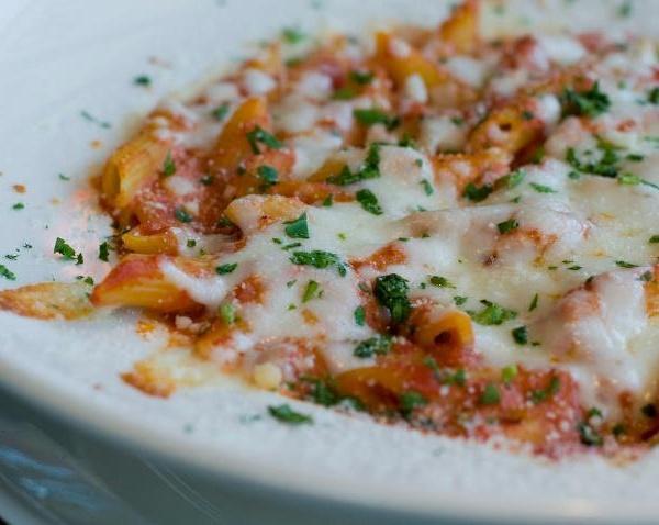 Baked Ziti · Ziti pasta combined with ricotta, mozzarella cheese and house marinara sauce. 