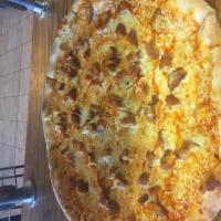Chicken Wing Pizza · Breaded white meat chicken with your choice of wing sauce. Includes side of bleu cheese and ...