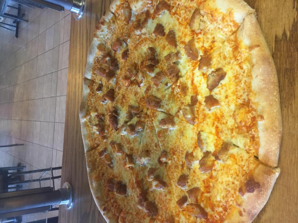Chicken Wing Pizza · Breaded white meat chicken with your choice of wing sauce. Includes side of bleu cheese and celery.