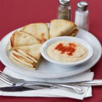 Hummus Starter · A blend of garbanzo beans, virgin olive oil, and Mediterranean spices and tahini. Served wit...