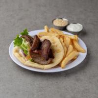 Gyro Pita Sandwich · Slices of gyro, tomatoes, onions, lettuce and tzatziki sauce. Served with Steak Fries