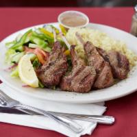 Lamb Chops · Four charbroiled lamb chops marinated with olive oil, lemon and herbs.