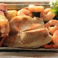 40. Steamed Tilapia and Shrimp · 5 pieces of shrimp and 1 piece of tilapia. Served with potatoes and vegetables.