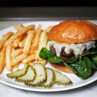 The Bartlett Burger · Niman Ranch beef, caramelized onion, chive aioli, gem lettuce, house pickles, served with ch...