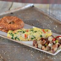 Western Omelet · Fluffy 4-egg omelet with peppers, onions, ham and cheddar cheese. Served with home fries and...