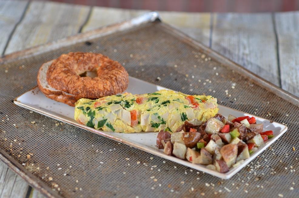 Western Omelet · Fluffy 4-egg omelet with peppers, onions, ham and cheddar cheese. Served with home fries and choice of buttered toast or bagel.