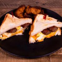 Breakfast Sandwich · With eggs, breakfast meat and cheese on biscuit or toast.