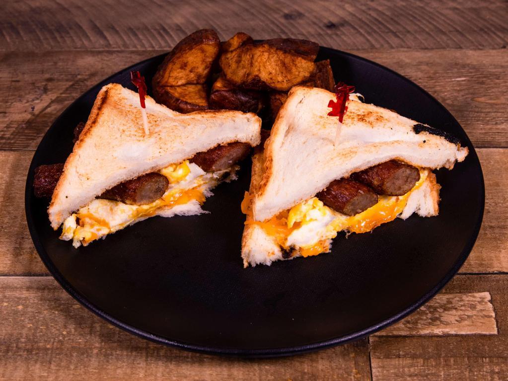 Breakfast Sandwich · With eggs, breakfast meat and cheese on biscuit or toast.