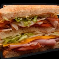 Classic Club Sandwich · Roasted turkey, black forest ham, hickory smoked bacon, cheddar, lettuce, tomato, mayo and o...