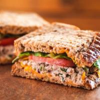 Tuna Melt Sandwich · Tuna salad, cheddar, tomato, romaine and grain bread. For adding additional ingredients, you...