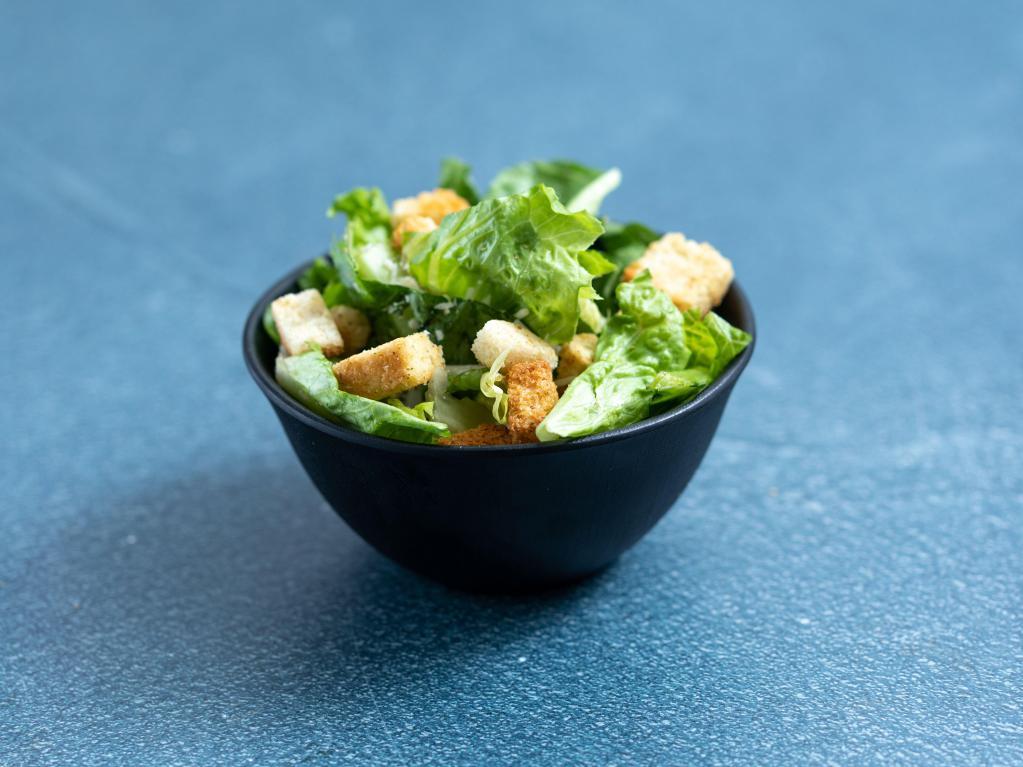 Caesar Salad · Fresh romaine lettuce topped with croutons and pecorino Romano cheese, tossed with our delicious homemade Caesar dressing.