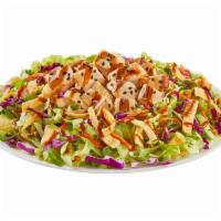 Asian Chicken Salad · Shredded lettuce, carrots, cabbage, green onions and cilantro with wonton strips, sesame see...