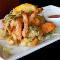 AP5. Tempura Shrimp · Jumbo shrimp and fresh vegetables battered and deep-fried, served with tempura dip.