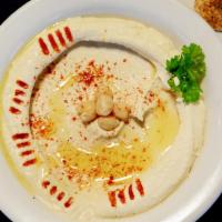 Hummus Dip · Chickpea puree blended with tahini paste, garlic and lemon juice. Topped with olive oil and ...