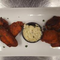Wings · Lightly smoked then fried, tossed in our house made wing sauce. Served with Gorgonzola aioli.