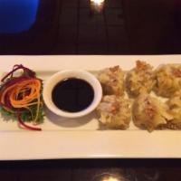 6 Piece Steamed Dumpling · Stuffed with chicken served with garlic soy sauce (contain saseme oil)