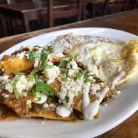 Chilaquiles En Salsa Verde · Crispy tortillas bathed in our Homemade Salsa Verde. Served with Peruano Beans, 2 Eggs any s...