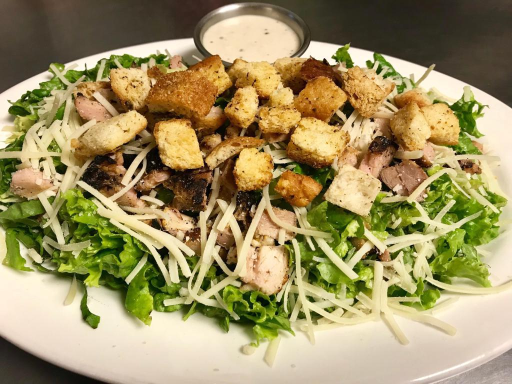 Caesar Salad · Traditional salad with chicken, croutons, Parmesan cheese and Caesar dressing. Includes freshly grilled chicken and 2 ounces of dressing on the side.