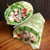 Honey BBQ Chicken Wrap Combo · Lettuce, red and green peppers, cucumbers, caramelized onions, chicken, tomatoes and honey B...