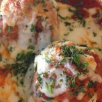 Meatball Parmesan · Beef meatballs with our tomato sauce, mozzarella and oregano. Heated.
