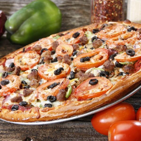 Yard Sale Pizza · Italian sausage, pepperoni, salami, black olives, fresh mushrooms, green peppers, red onions, vine ripe tomatoes, tomato sauce, mozzarella and cheddar.
