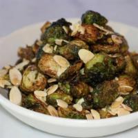 Roasted Brussels Sprouts · Honey Truffle , shaved almonds, bacon