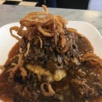 Lucky's Famous Meatloaf · Homemade meatloaf, mushroom demi glaze sauce, mash potatoes and frizzled onions.