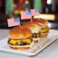 Lucky's Jr. Burgers (2)  · Two slider size burgers, Choice of Fries or sliced apples