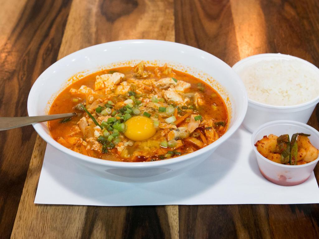 Soondubu Soup · Soft tofu soup with mixed vegetables, scrambled eggs and hot pepper powder. Served with white rice on the side.