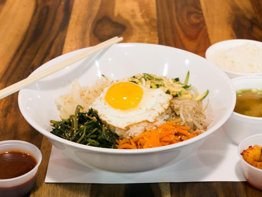 Bibimbap · 5 kinds of vegetables served with white rice and fried egg, drizzled with sesame oil, sprinkled with pieces of nori and sesame seeds. Served with miso soup.
