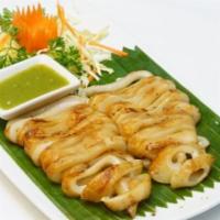 Grilled Squid · Whole squid marinated, grilled and served with a Thai style seafood sauce.
