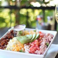 Cobb Salad · Herb roasted free range chicken breast, ham, bacon, avocado, tomatoes, hard-boiled egg, ched...