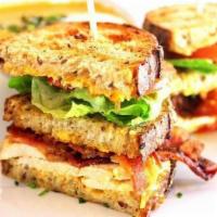 B.L.T.C. Sandwich · Bacon, lettuce, tomato and herb roasted free ranch chicken breast with harissa seasoned home...