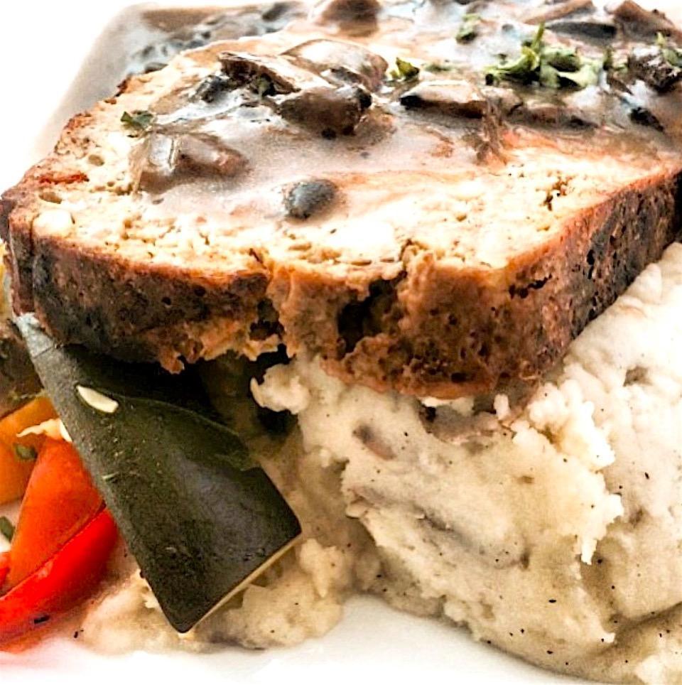 Turkey Meatloaf · A generous serving of meatloaf made with pine nuts and sun-dried tomatoes. Served with sauteed garlic green beans, mashed potatoes and sage mushroom gravy.
