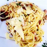 Spaghetti Carbonara · Tossed with cream, bacon, egg yolk, black pepper and crispy Italian bacon topped with shaved...