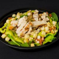 KZ's Wellness Salad · Romaine lettuce, spinach, tomatoes, chicken, quinoa, guacamole, sliced almonds, cranberries,...