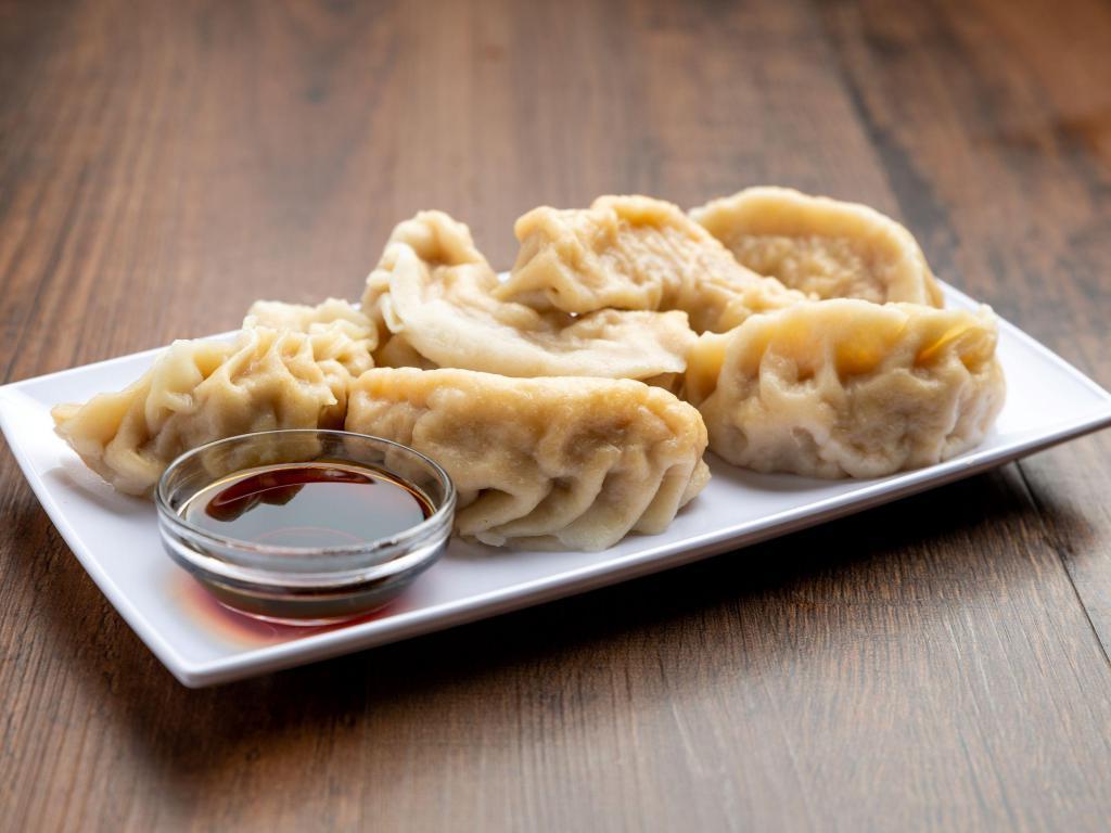 Pot Stickers · 6 pieces. Chinese dumplings filled with pork and cabbage.