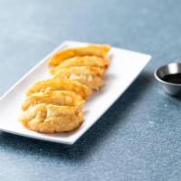 Chicken Pot Stickers · Wonton wrappers are stuffed with chopped chicken and vegetables, steamed and then pan-fried....