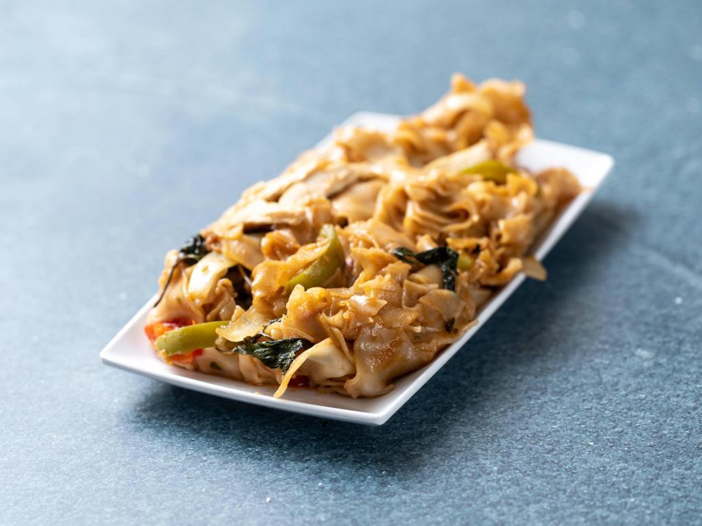 Pad Kee Mao · Drunken noodles. Pan-fried flat rice noodles with a choice of chicken, pork, tofu or mixed vegetables, tomatoes, bell peppers, onions, basil and chili-garlic sauce. Spicy.