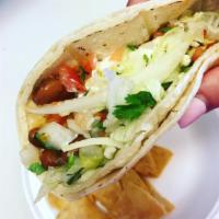 Vegetarian Taco · Lettuce, tomato, onion, cilantro, cheese, rice, beans, sour cream and guacamole.