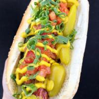 Buldogis Chicago Hot Dog · Relish, tomato, onions, peppers, pickles, celery salt and mustard.