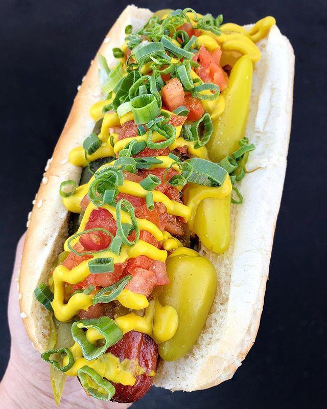 Buldogis Chicago Hot Dog · Relish, tomato, onions, peppers, pickles, celery salt and mustard.