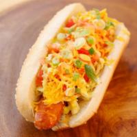 Vegetarian Hot Dog · Soy dog. Cole slaw, tomato, cheddar, green onions and honey dijon mayo. Vegetarian.