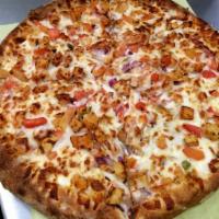 California Chicken Pizza · White garlic sauce, grilled chicken, onion, Canadian bacon, Roma tomatoes and feta cheese.