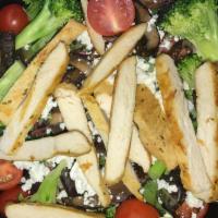 Backyard Summer Salad · Grilled chicken, portobello mushrooms, broccoli, tomato, goat cheese and mesclun greens.