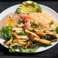 Pollo a la Plancha · Grilled chicken breast on spring mix, served with rice, beans, avocado, pico de gallo and to...