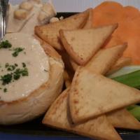 Slaters Vampire Dip · Roasted garlic and artichoke hearts blended with creamy melted cheese served in a sourdough ...
