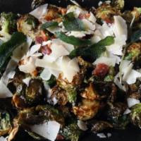 Crispy Brussels Sprouts · Tossed with balsamic vinaigrette, bacon, shaved Parmesan and fried sage.