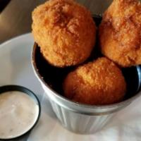 Fried Bacon Mac and Cheese Balls · House-made bacon mac and cheese balls, breaded with panko and served with Tapatio ranch