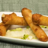 Cheese Rolls · Manchego and feta cheese in phyllo dough and fried crispy.